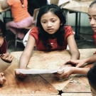 Kinderproject Guatemala vrijwilligerswerk mooie foto 3 kinderen in de klas 